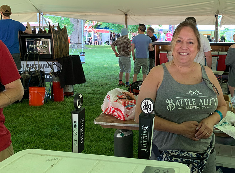 Battle ally tap handles on display at summer beer fest.